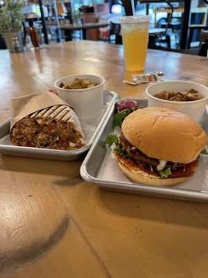 Vegan wrap and vegan burger with potatoes as the side. Mmm.  at FarmHand Kchn in St Augustine
