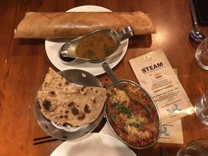 Masala dosa with samba (top) and sev tamater sabji (sweet and sour dish with tomato) and roti  at Steam in Rotorua