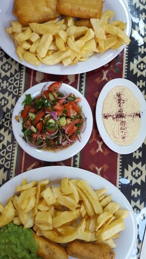 Tofish and chips plus battered sausage and chips with a side of mushy peas at Shakey Shakey in Ramsgate