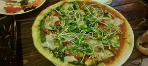 Green pizza, one half with tom, one half with pesto at Rad Rabbit in Chiang Mai