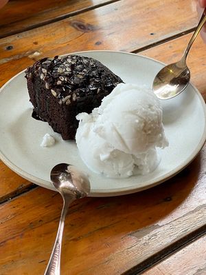 A hot, chocolate brownie 🤤 with coconut ice cream   at Rad Rabbit in Chiang Mai