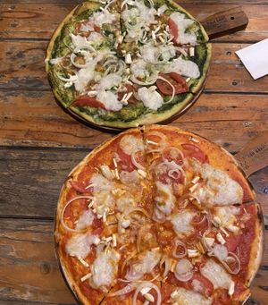 Two farm villa pizza, one with tomato base and one with pesto base  at Rad Rabbit in Chiang Mai