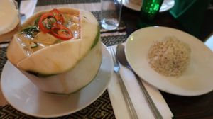 Red curry in a coconut with brown rice  at Rad Rabbit in Chiang Mai