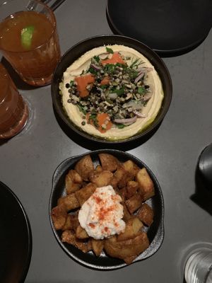 Fekkeh hummus and crispy potatoes with a garlic sauce at The Hummus Club in Northbridge
