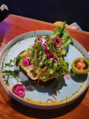 Avocado toast. It had lots of other things in it so if ordering for  kids make it clear what you want. at Rainbow Cafe in Ella