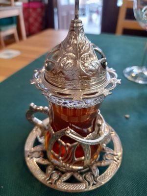 Their special herbal infusion. (With a sugar cube in the lid) at Falafelmania - Restaurante Vegetariano y Vegano Oriental in Alicante