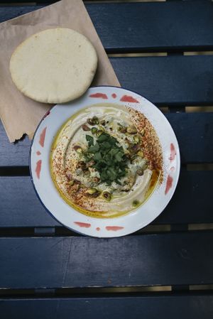 Hummus Persepolis with pistaccios, cauliflower and green tahini sauce at Mashery - Hummus Kitchen in Cologne