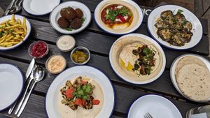 Hummus chili sin carne, hummus with mushrooms, roasted cauliflower, eggplant (plus bread, fries, falafel, pickles and sauces) at Mashery - Hummus Kitchen in Cologne