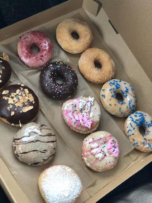 Dozen: cannoli, animal cracker, glazed, chocolate glazed, dirty chai, cinnamon sugar at Misfit Doughnuts & Treats in Rochester