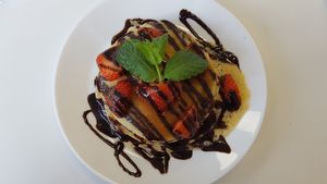 pancakes with strawberries and chocolate sauce at 143V in Cork