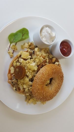 breakfast bagel with seitan sausage, tofu scramble, mushrooms and onion.  at 143V in Cork