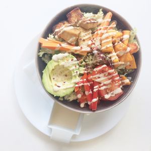Rainbow Bowl with garlic & ginger marinated tofu, avocado,sweet potatoes & raw vegetables, tahini dressing, chilli flakes & toasted sesame seeds - €12.50  at 143V in Cork