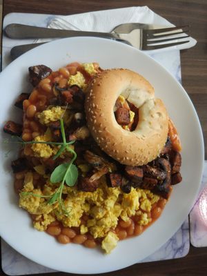 Bagel with vegan omelet, beans, seitan and mushrooms. at 143V in Cork