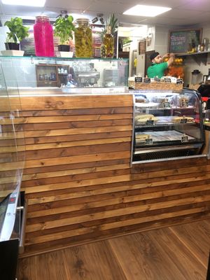 Inside Falafel Xpress, interior, fridge section and view into the open-plan kitchen area. at Falafel Xpress in Chester