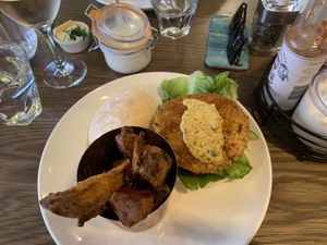 Blackened spicy tempeh burger with sweet potato fries on the side. (Also vegan mayo on top right) at Liberty Grill in Cork