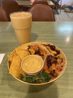 Mango zinger smoothie and gogi tacos with a side of chips and the best queso I’ve had    at Juice Pharm in Duluth