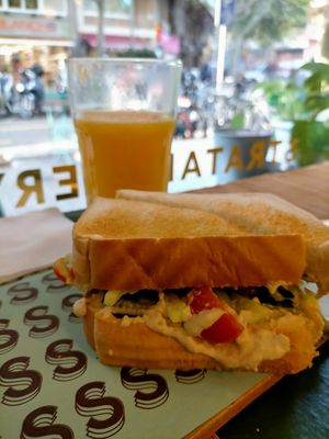 Hummus sandwich and orange juice at Strata Bakery in Barcelona