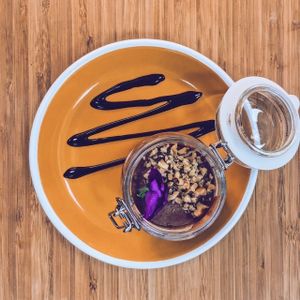 Guilt free raw cheesecakes - this is with chocolate and edible flowers :)  at Seva Table in Dubai