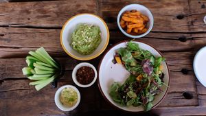 Salad, guac, veg sticks and sweet potato fries at Seva Table in Dubai