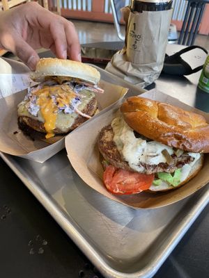 Buffalo burger (L) and jerk burger (R)  at Farmacy Vegan Kitchen & Bakery in Tampa