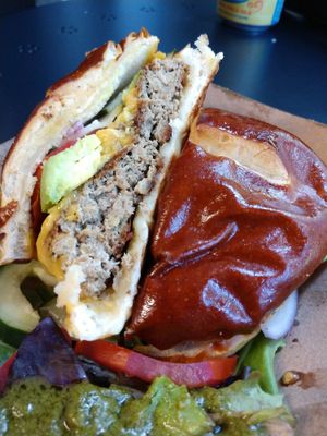 Farmacy Burger with "cheese" and avocado. at Farmacy Vegan Kitchen & Bakery in Tampa