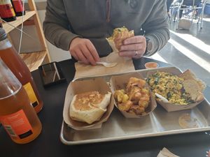 We had the breakfast burrito add pepperjack cheese and scrambled platter. Service is pretty good And delish at Farmacy Vegan Kitchen & Bakery in Tampa