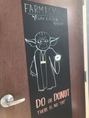 The door you will find if you’ve entered through the wrong entrance.. 😄 it has a doorbell but, best to go through the market.  at Farmacy Vegan Kitchen & Bakery in Tampa