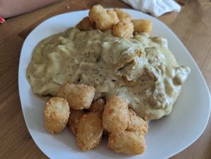 Biscuits and gravy with tater tots. at Kahiau's Bakery & Cafe in Virginia Beach