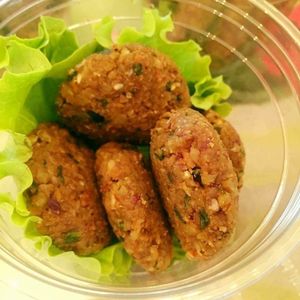 Raw vegan meatballs from Almonds, served with tomato sauce at Little Tyke in Bucharest