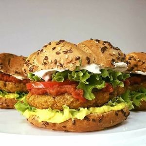 Tasty Vegan burger with cashew cheese, hummus, black Bean patty, lettuce ... at Little Tyke in Bucharest