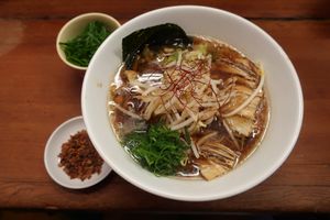 Vegan ramen with extra mock meat, spring onions and fried garlic as add-ons at Kyushu Jangara Ramen - Akihabara in Tokyo