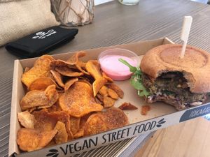delicious mushroom burger with crispy sweet potato chips and beetroot veganaese at Tökmag Vegan Street Food in Budapest