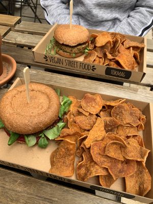 Burgers and potato crisps at Tökmag Vegan Street Food in Budapest