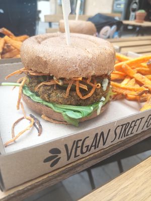 Green pea burger with sweet potato fries at Tökmag Vegan Street Food in Budapest