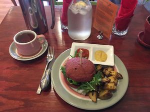 Red pepper glazed fiddlehead sandwich, house made Dijon and ketchup, and Chaga Yarrow spiced tea. All delicious! at Bistro Red Beet in Wasilla