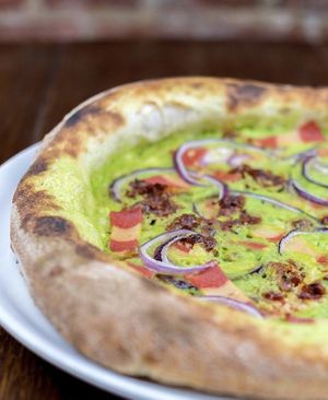 Peas cream and vegan bacon 🌱  at Pizzi & Dixie in Madrid