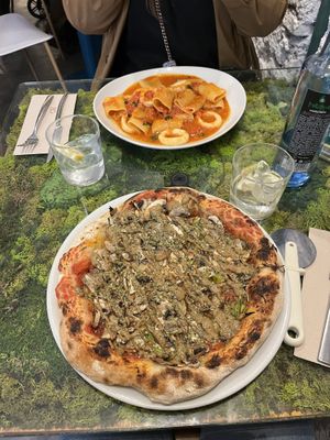 pistachio garlic pizza and calamari pasta  at Pizzi & Dixie in Madrid