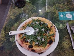 Pizza Gorgonzola and Arugula, pumpkin base at Pizzi & Dixie in Madrid