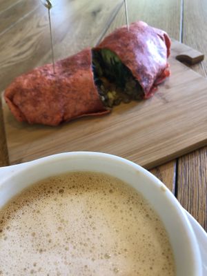 Oat milk cappuccino and vegan breakfast wrap 🌱 at Lola's Cafe in Ladera Ranch