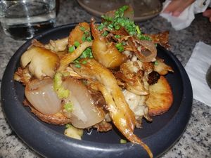 Roasted potatoes, wild mushrooms and onion over garlic confit at Bana in Tel Aviv