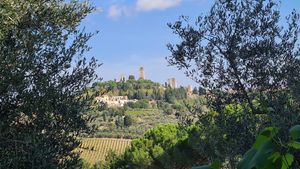 View of San Gimignano from the dining area! at Vegan Agrivilla I Pini in San Gimignano