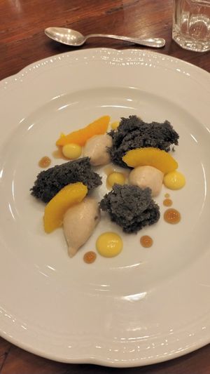 Loved the charcoal sponge cake, vanilla cream & zesty oranges 🍊 at Vegan Agrivilla I Pini in San Gimignano
