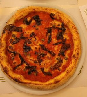 Pizza with tomato and algae at La Taverna di Pulcinella in Pisa