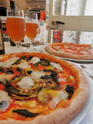 Pizza vegetariana and Pizza porcini (both with vegan Mozzarella) at La Taverna di Pulcinella in Pisa