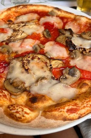 Pizza mozzarisella, aubergine, tomato sauce, mushrooms, peppers  at La Taverna di Pulcinella in Pisa