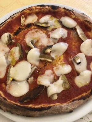 Porcini pizza with vegan cheese at La Taverna di Pulcinella in Pisa