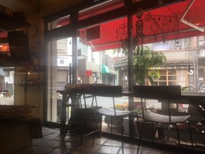 Chairs overlooking an organic store across the street at The Market in Okayama