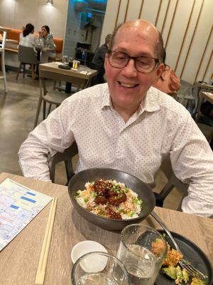 Friend eating at Happy cow at Beyond Sushi in New York City