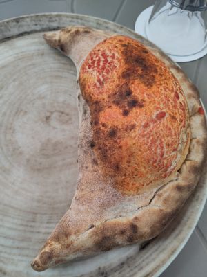 Vegan Calzone baked in a wood fired oven at Birra & Farina in Castelletto Sopra Ticino