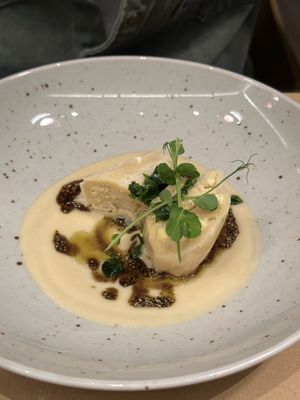 Cottage cheese dumplings, celeriac, aged chickpea miso, pumpkin seeds, parsley  at Bistro Maha in Ljubljana